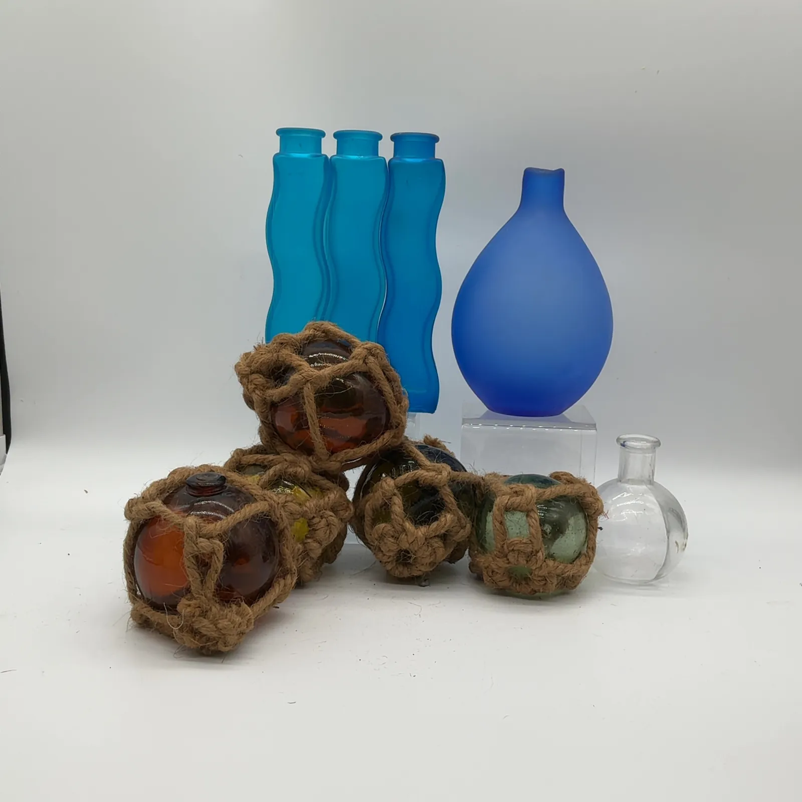 Colored Glass Vases and Rope-Wrapped Fishing Floats