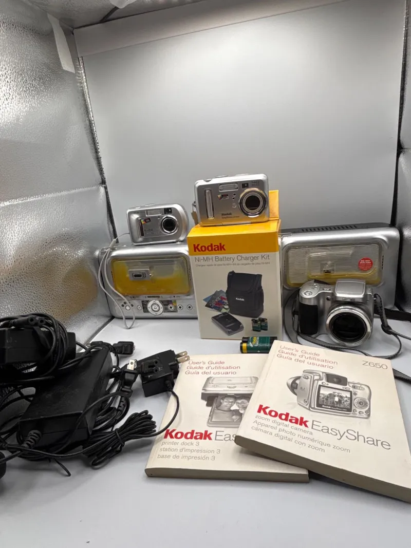 Kodak EasyShare Camera Bundle – Cameras, Dock, Charger & More - Sequim Estate Auction – A Life of Adventure & Humor | Ocean Bid Auction