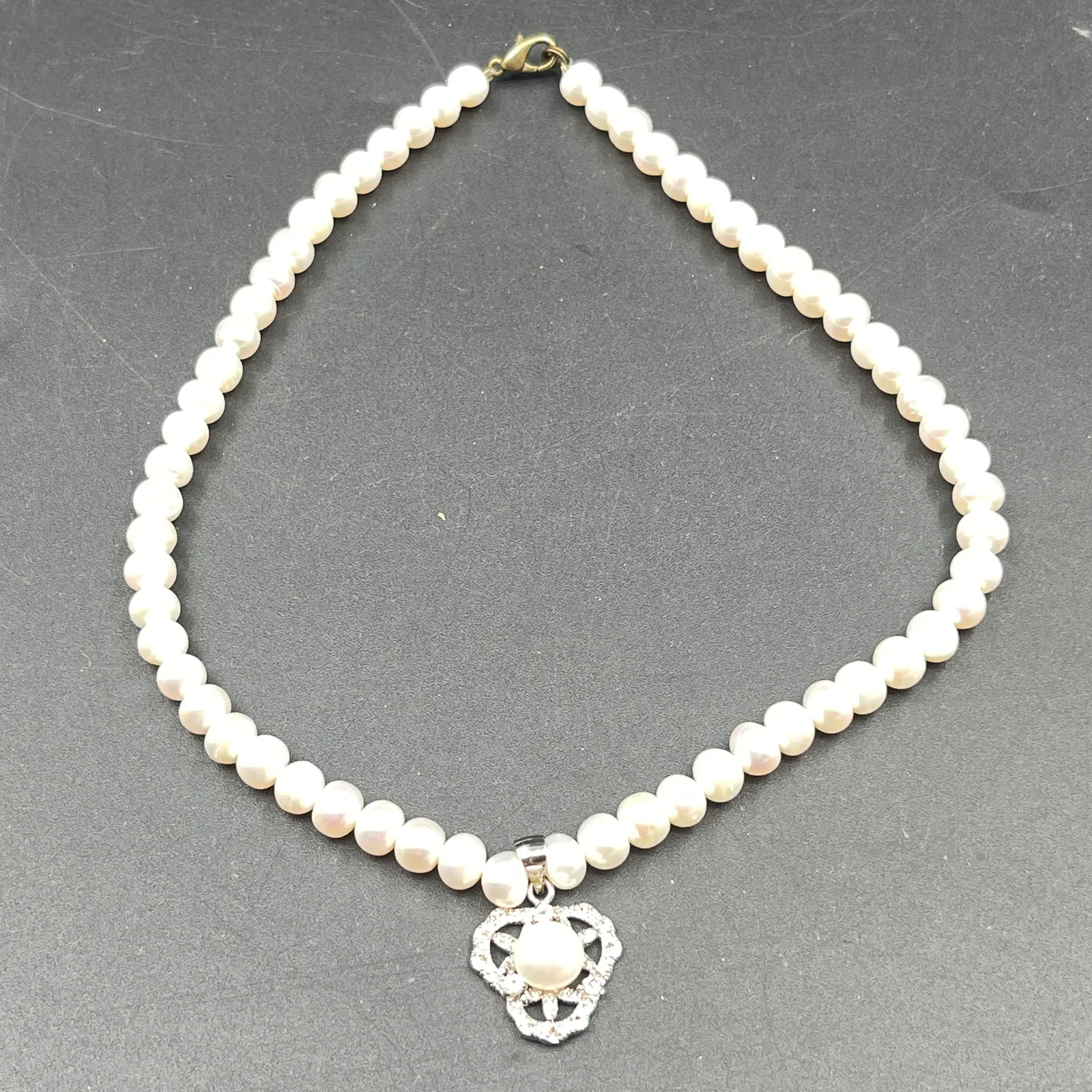 Pearl Necklace with 18KG-Marked Rhinestone Pendant - Sterling Silver, Stones & Seattle History Estate Auction and 0% buyers premium! | Ocean Bid Auction