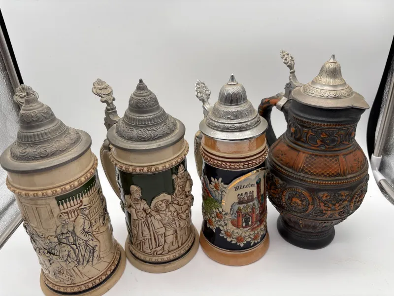 German Beer Stein Collection – Munich Scenes & Ornate Relief Mugs - Newcastle Estate Collection - STERLING SILVER, GOLD TEETH, Antiques & Collectibles | Ocean Bid Auction