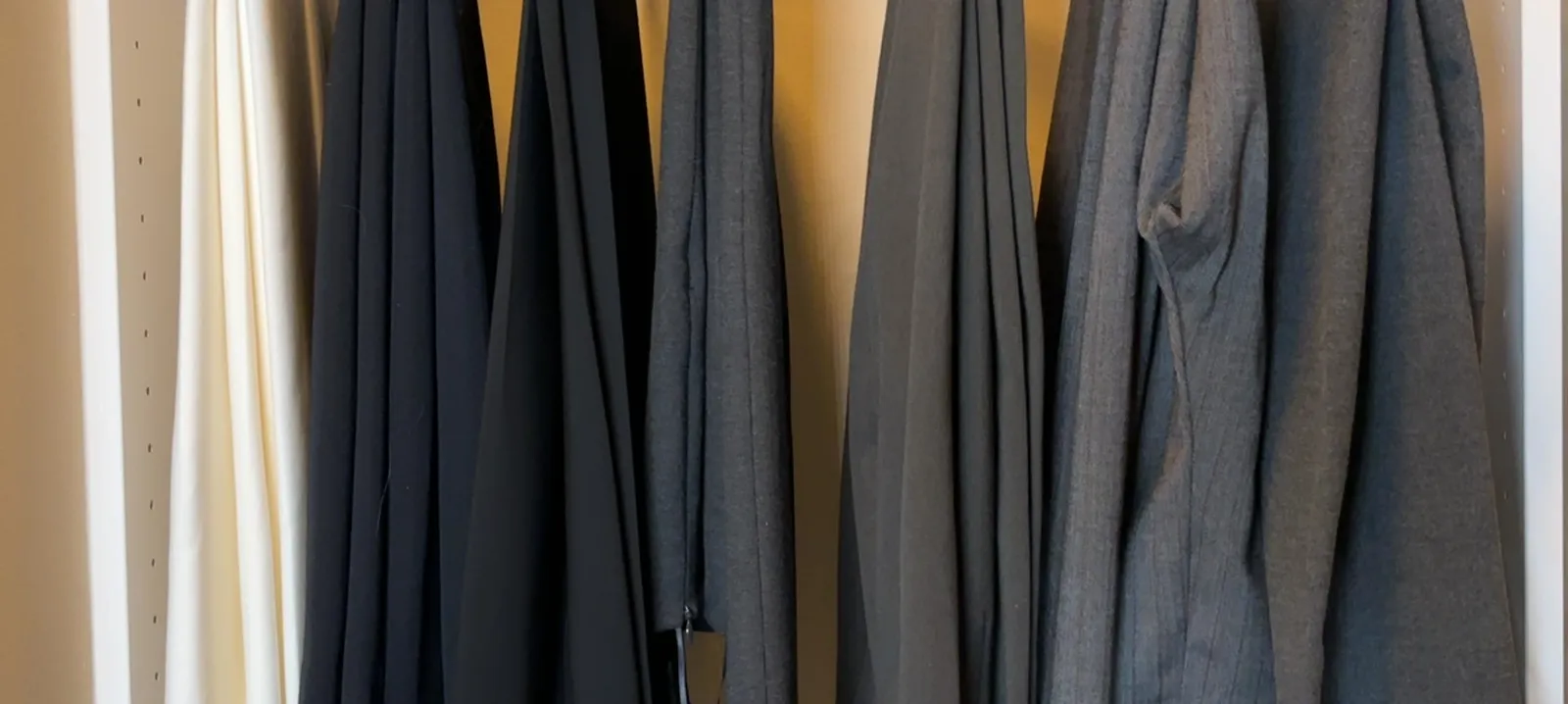lot of dress pants and jeans
